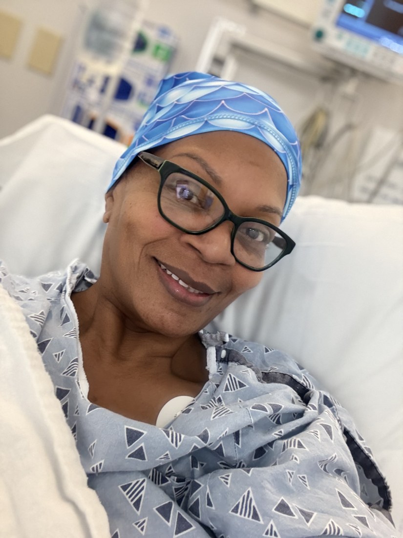 Dr. Cece in the hospital in a blue cap